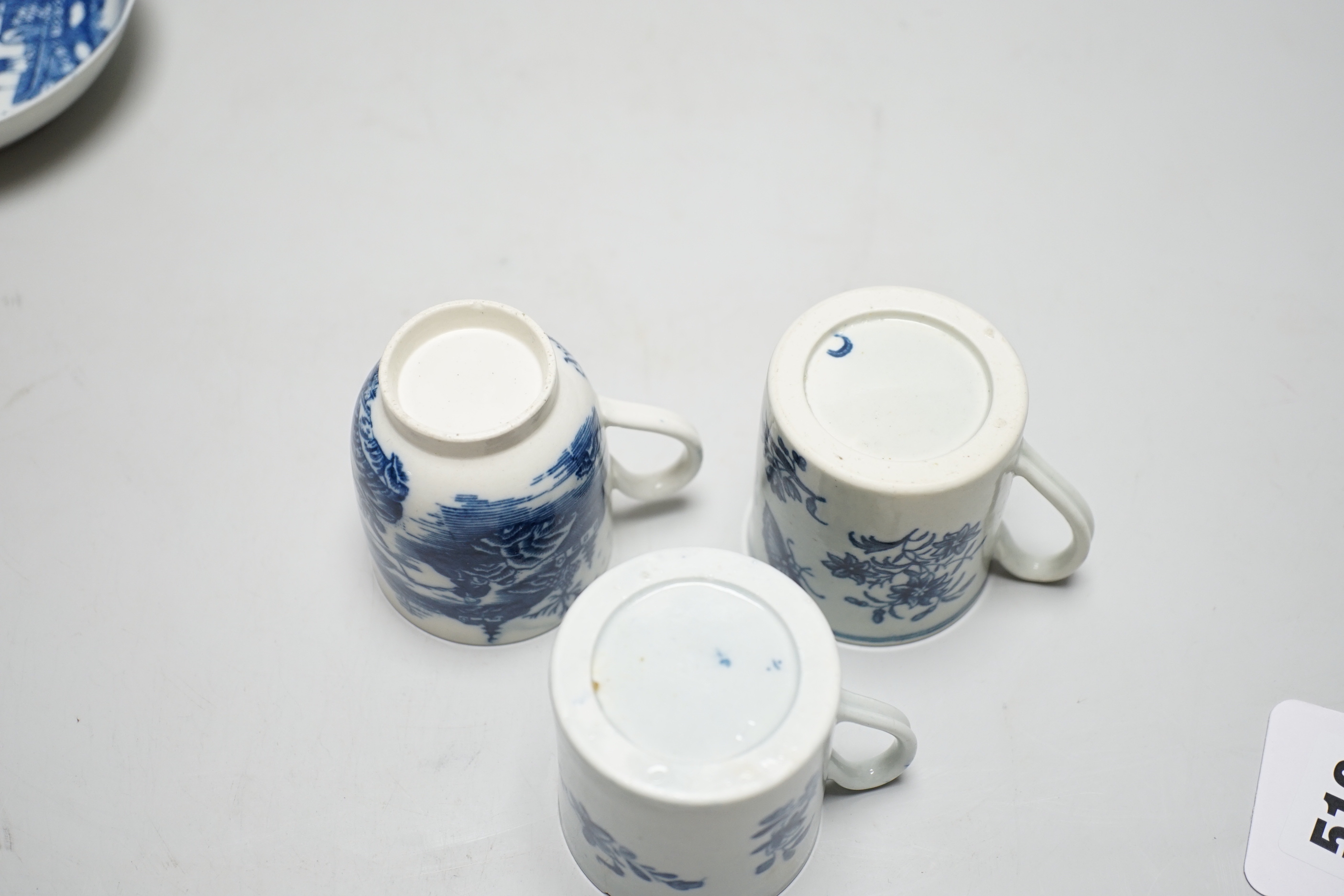 Two Worcester coffee cans, Mansfield and Three Flowers patterns, and a Worcester/Caughley coffee cup and saucer, Fisherman and Cormorant pattern